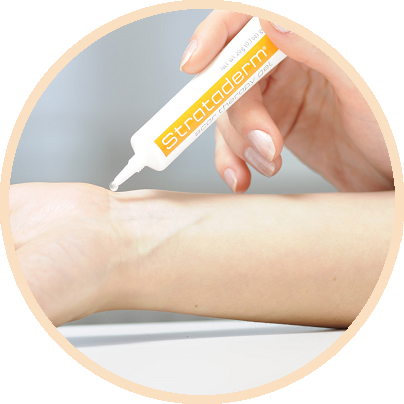 Applying a thin layer of Strataderm to the skin